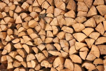 Large number of broken firewood stacked in a pile
