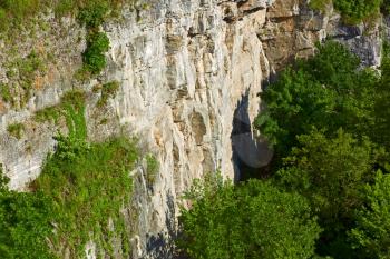 Detail of giant vertical rocky walls in canyon of Smotrych river in Kamianets-Podilsky, Ukraine