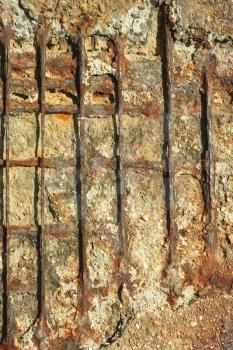 Detail of old outdated reinforced concrete structures with rusty iron rods outside