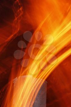 Abstract flame texture with old metal chimney at night