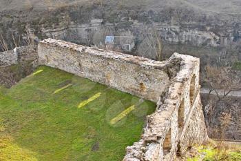 Fragment of ancient walls of the medieval fortress above the canyon in Kamianets-Podilskyi, Ukraine, early spring, view from above