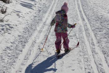Young girl skiing on a ski track 30351