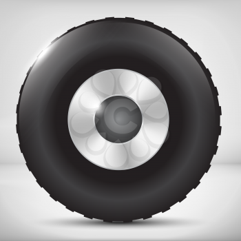 Black car wheel with metallic disks with light background