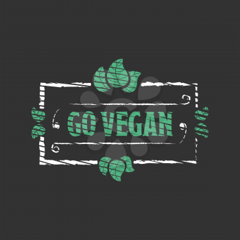 Go vegan Organic food engraved icon with leafs on black background