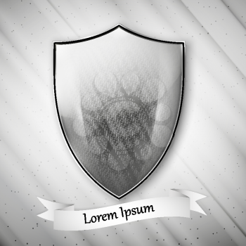 Spartan image. Metal shield on dirty gray background. Vector format.