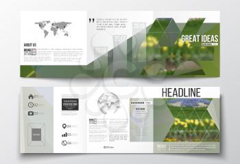 Vector set of tri-fold brochures, square design templates with element of world map and globe. Colorful polygonal floral background, blurred image, yellow flowers on green, modern triangular texture