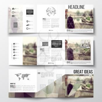 Vector set of tri-fold brochures, square design templates with element of world map and globe. Polygonal background, blurred image, vacation, travel, tourism. Modern triangular vector texture.
