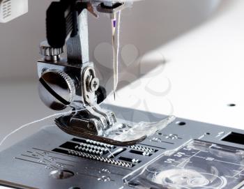 Close-up of modern sewing machine foot