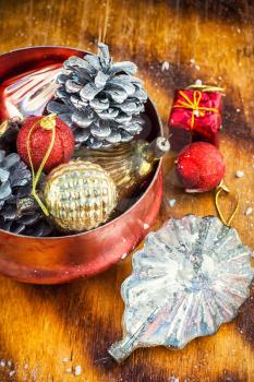 Christmas decoration for decorations on snowy wooden background.Photo tinted.