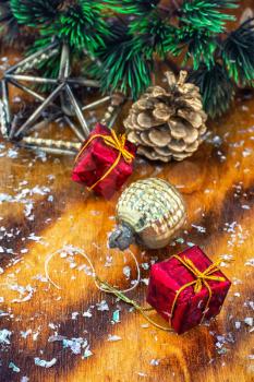 Festive Christmas decorations on wooden background in vintage style.Photo tinted.