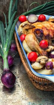 chicken baked with mushrooms,potatoes and vegetables in glass form