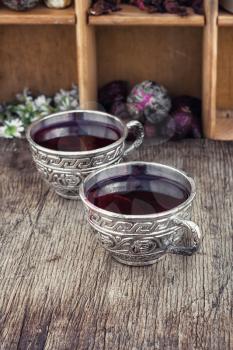 Medicinal tea a decoction of hibiscus tea in stylish cups.