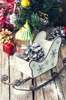 Stylish Christmas Santa's sleigh with gifts and a bump.