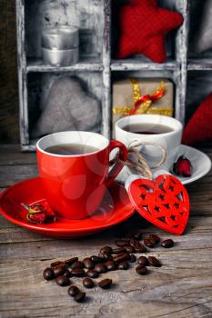 Two coffee cups,grains and decoration of hearts for Valentine's day