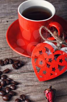 Red coffee Cup decorated with linked hearts and grain