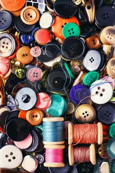Texture of variety of buttons from clothing and thread.Top view