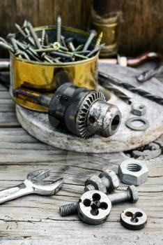 Set of nuts,bolts,springs and dies for threading
