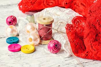 Sewing kit made of lace,buttons,beads and thread with needle