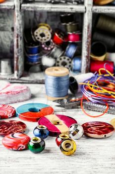 Accessories for repair and sewing of clothes and jewelry.Selective focus
