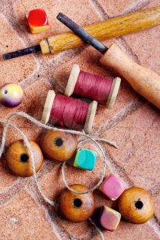Wooden jewelry beads and tools for needlework at home