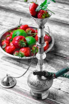 Small smoking hookah with strawberry,mint and lime
