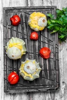 Autumn dish of scallops baked in cheese with tomatoes