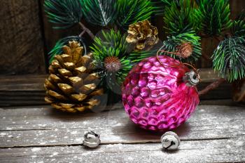 Old-fashioned russian glass Christmas decorations and fir branch