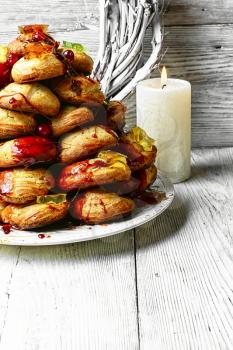 croquembouche cake decorated with caramel threads and cranberries with marmalade