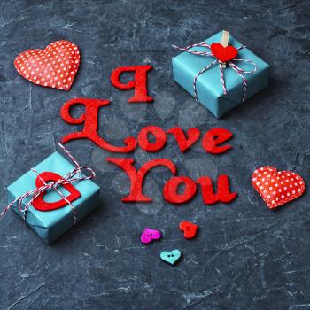 Valentines wrapped gift on slate backgrounds with the inscription I love you