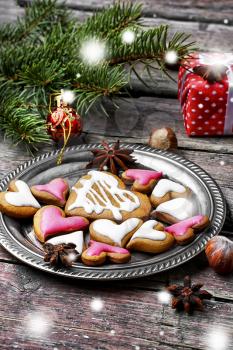 Homemade Christmas cookies in the shape of hearts on saucer