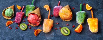 Summer ice cream assortment of fruit flavors with kiwi and pomegranate