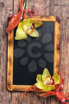 chalk board with space for your test buds decorated with Orchid in vintage style