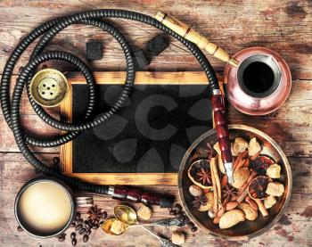 aroma oriental hookah with coffee in vintage style.Copy space