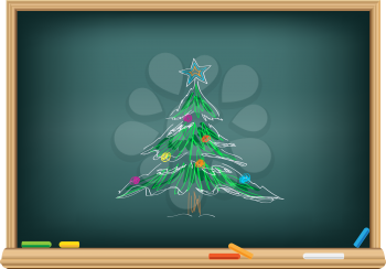 Drawing christmas fir by a chalk on the classroom blackboard