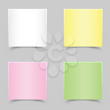 The white green yellow and pink papers with shadow on the gray background