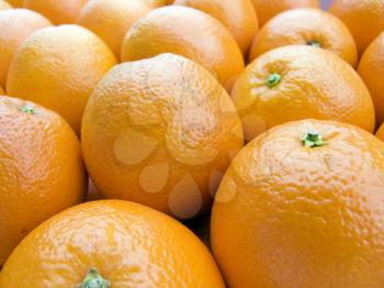 The beautiful oranges on a counter, fruit background close up