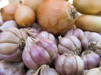 Agricultural background, a pile of beautiful bulb onions and garlic