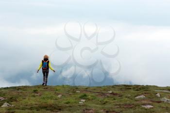 The girl on top of the mountain Hoverla in Ukraine