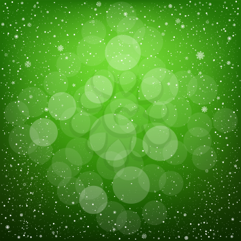 Winter green bokeh background with snow. Christmas and New Year backdrop