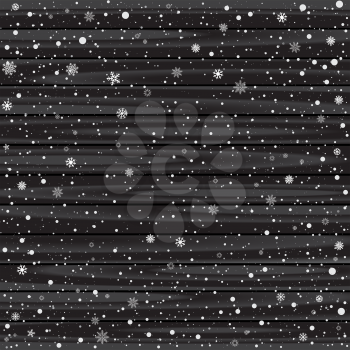 Snow and black wood backdrop. Christmas dark wooden background texture