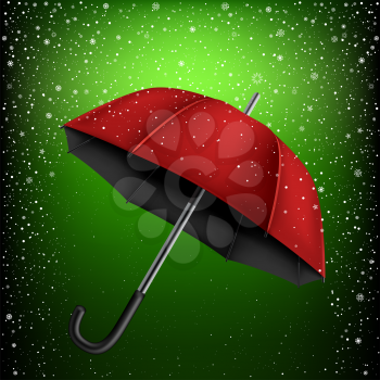 Red and black umbrella on green snow background. Christmas and New Year theme