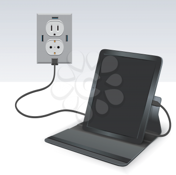 Black tablet charging from usb outlet on light background. Mobile phone charge