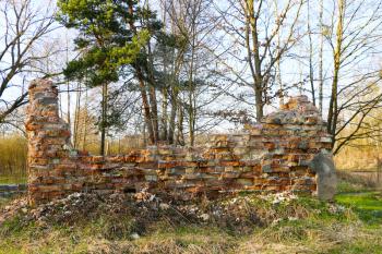 Red bricks ruins wall from old house on natural background
