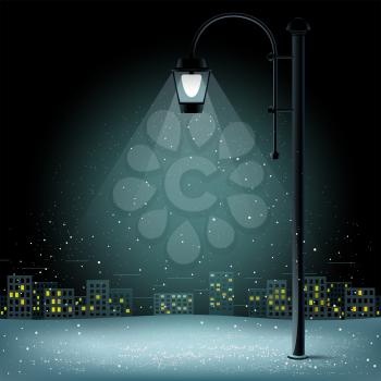 Snow in lamp lights. Christmas snowflakes falls on night city background. Large electric pillar