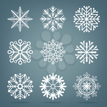 Frosty close-up snow set. Collection of white snowflakes variation isolated on dark blue background. Ice shape pattern. Winter Christmas holiday decoration