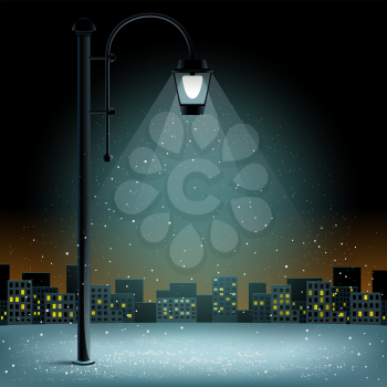 Snow in electric lamp lights. Christmas snowflakes falls on night city silhouette background. Large electric pillar