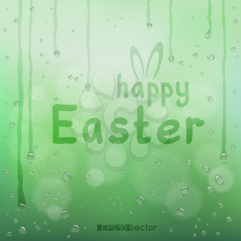 Happy Easter text on green blurry wet bokeh background. Nature spring holiday rabbit ears and finger write message natural water bubbles backdrop