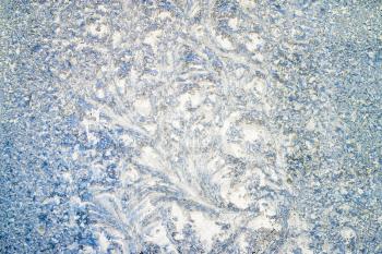 Frost pattern on glass window. Winter decoration background. Christmas backdrop