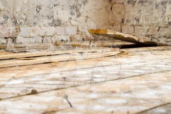 Old wooden floor and sticking board. Dirty broken sticking plank