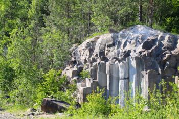 Basalt columns pile landscape rock and forest. Beautiful stone landscape